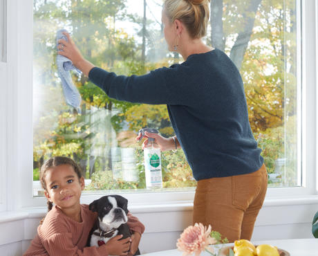 Woman washing window