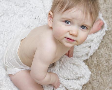 Child Sitting on Blanket