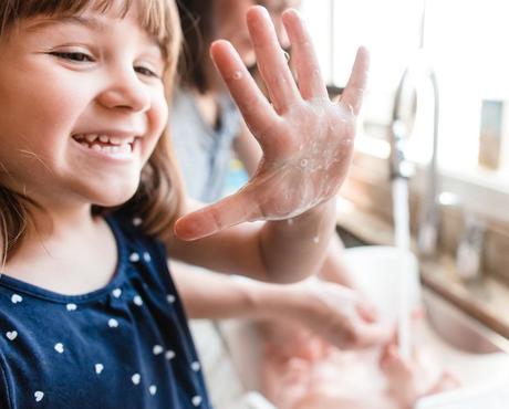 Girl washing her hands