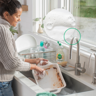 woman scrubbing dishes